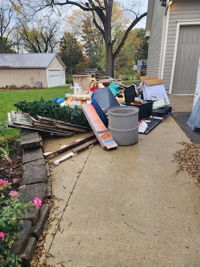 Dumpster being loaded with debris for Commercial Dumpster Rental in Jesup